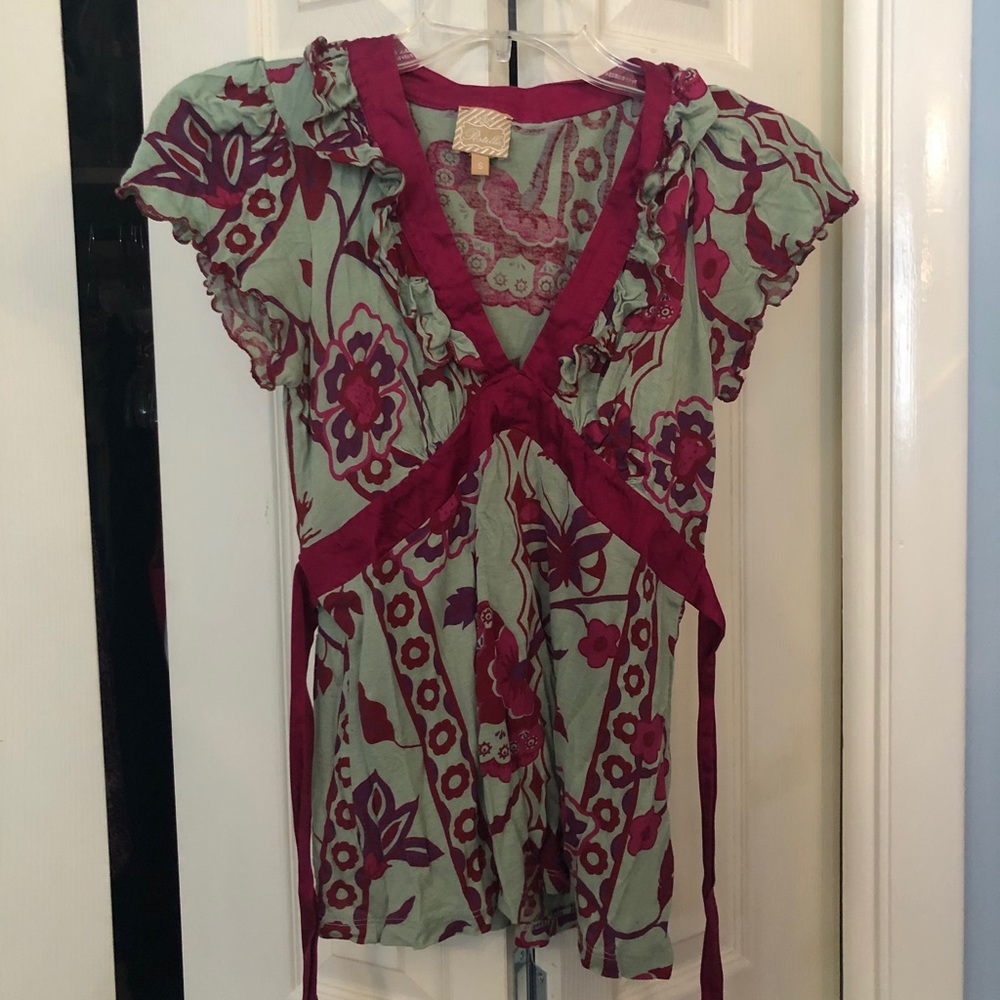 Green and pink patterned blouse with tie back